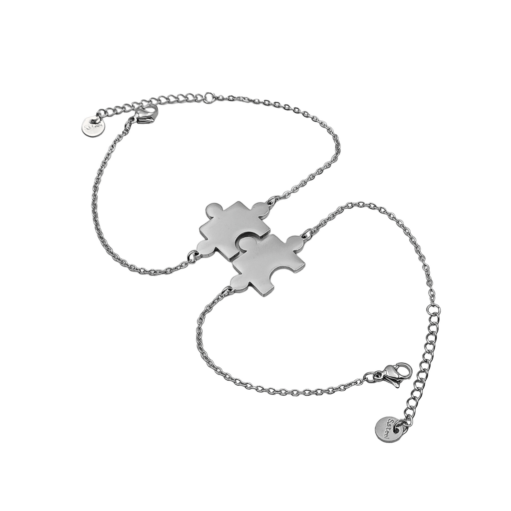 Coppia bracciali in acciaio puzzle incisione gratuita