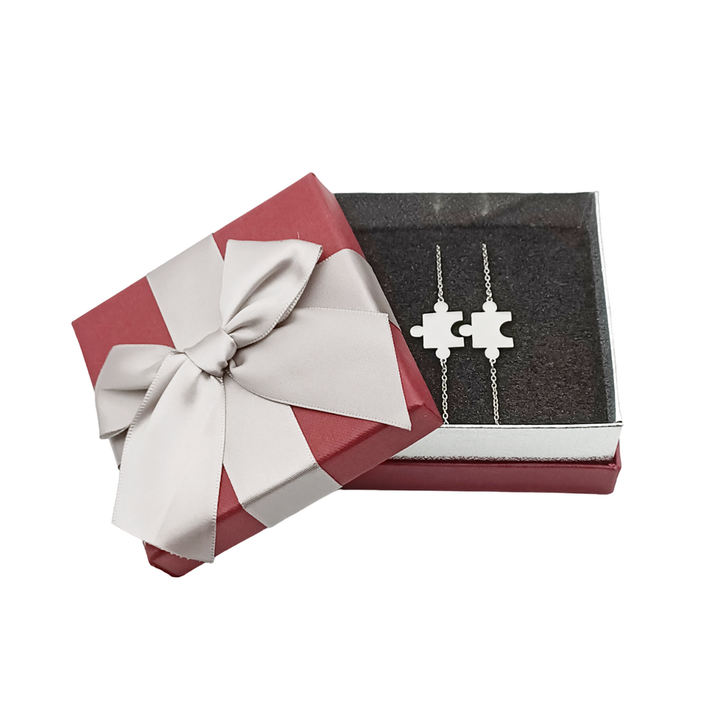 Coppia bracciali in acciaio puzzle incisione gratuita